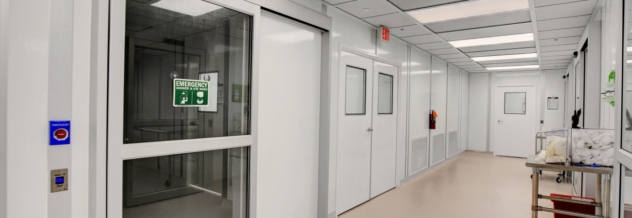 Modular Class 1000 cleanroom corridor with emergency exit, built by Allied Cleanrooms