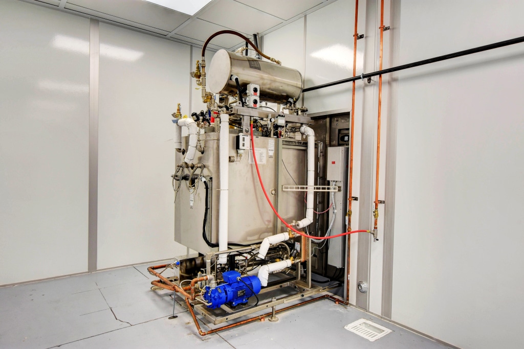 What is a Biotechnology Cleanroom? Understanding the Basics Industrial boiler and piping system inside a biotechnology cleanroom.