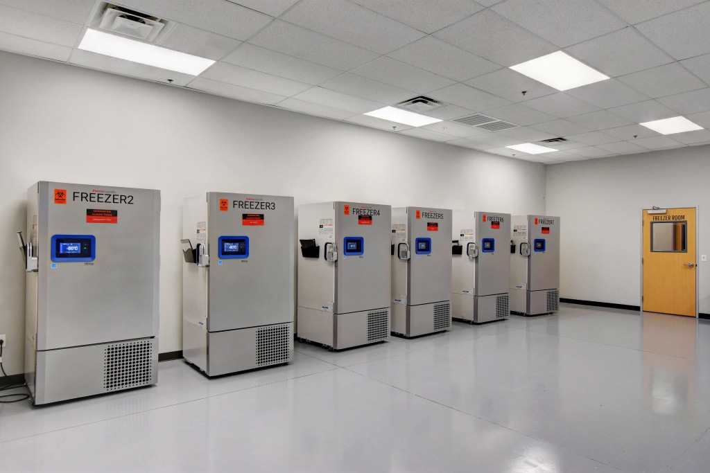 What is a Biotechnology Cleanroom? Understanding the Basics Row of industrial freezers in a biotechnology cleanroom used for low-temperature storage.