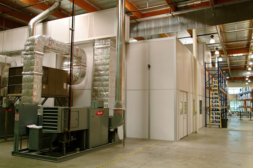 What Are Cleanroom HVAC Systems? An Overview An industrial cleanroom with air handling units, insulated ductwork, and modular walls.