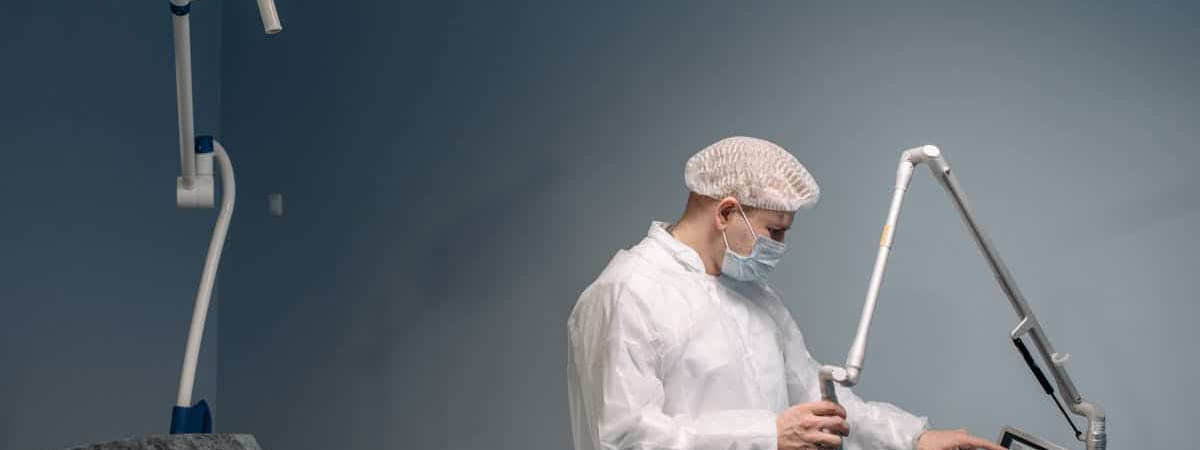 A doctor stands in an operating room.