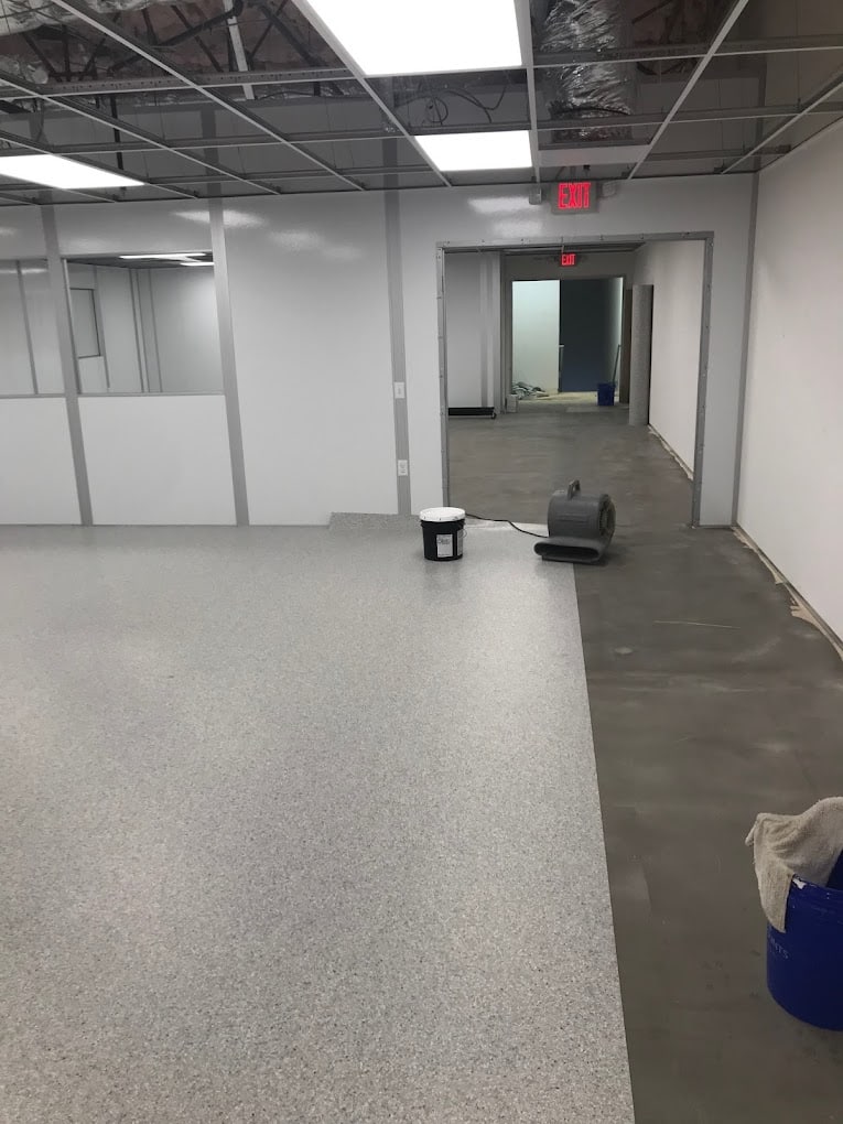 ESD Control in Cleanrooms: A Simple Guide Installation of flooring in a cleanroom environment.