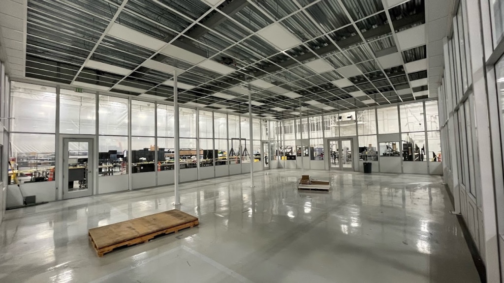 What Are the Requirements for an ISO 4 Cleanroom? An image of a grid ceiling of a modular cleanroom under construction.