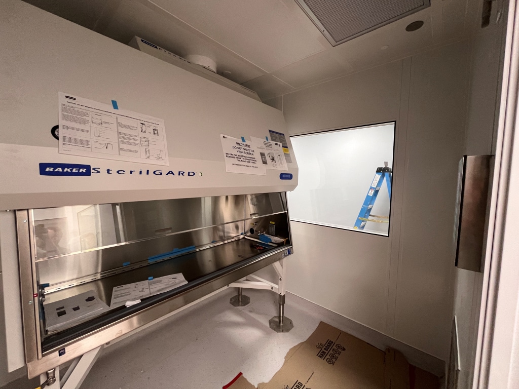 Biological Safety Cabinet (BSC) in a cleanroom, used for USP 797 sterile compounding and USP 800 hazardous drug handling.