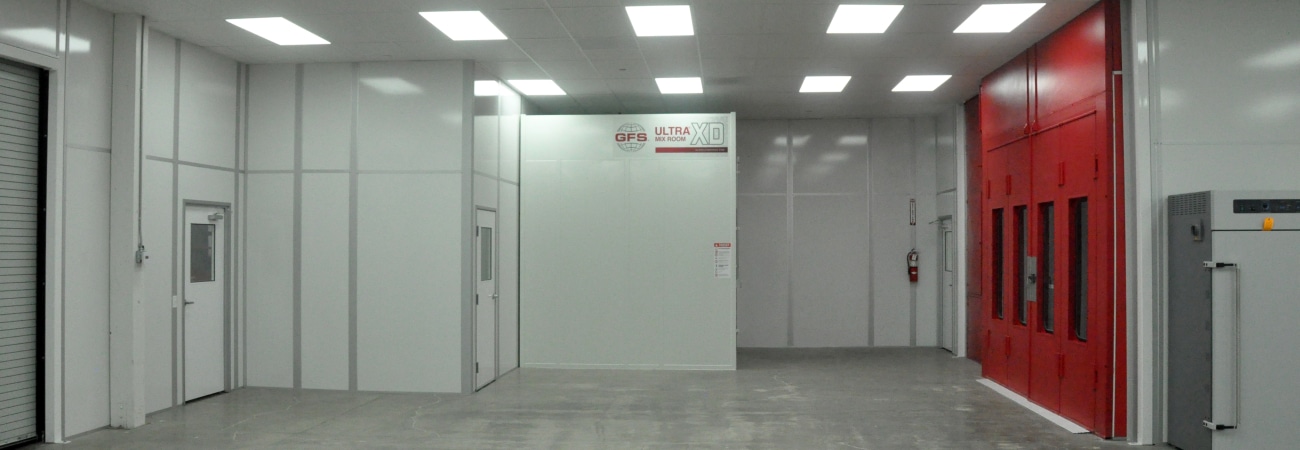 Automotive paint cleanroom by Allied Cleanrooms with modular walls and integrated lighting, designed for controlled painting or coating applications.